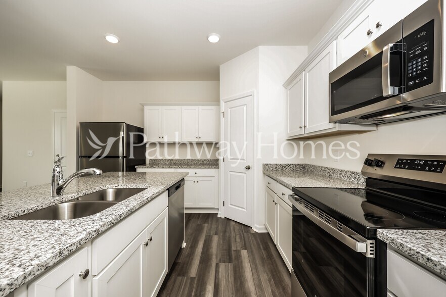 Building Photo - 202 Wild Daisy Wy