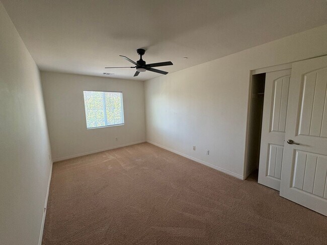 Building Photo - Spacious 4-Bedroom Home with Large Backyard.