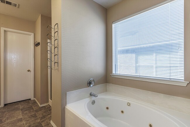 Jetted Garden Tub for those long days. - 416 Windy Hill Ln