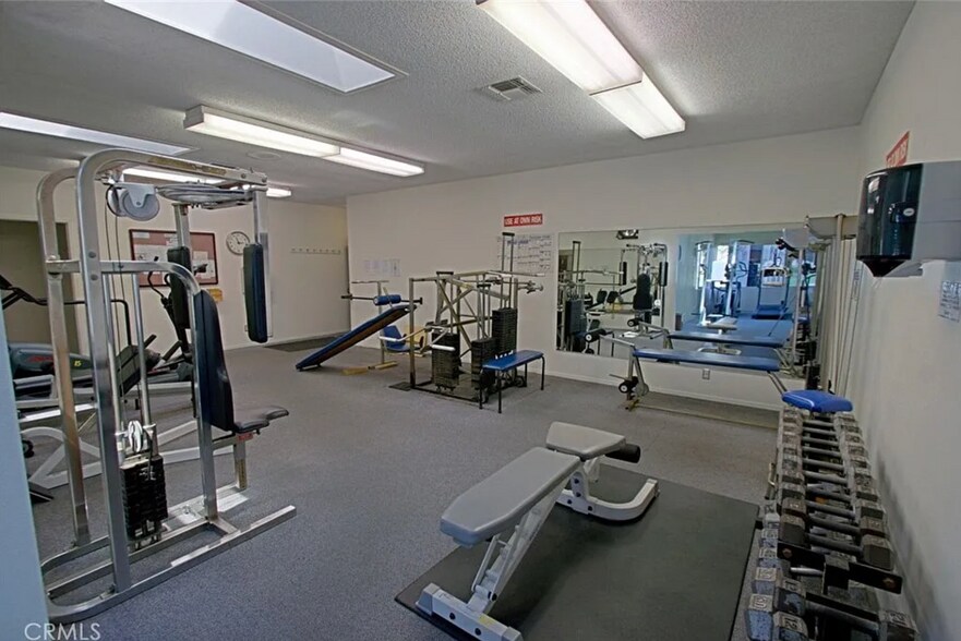 Fitness gym & weight room. - 8566 Larkhall Cir