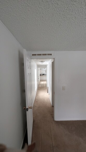 Hallway from extra bedroom 2 and 3. - 5237 Highway NN