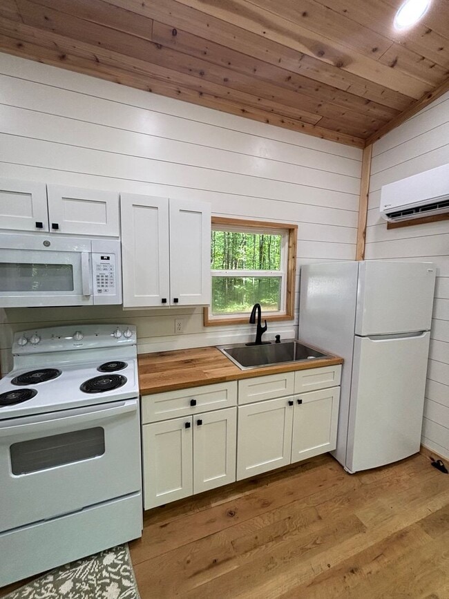 Building Photo - Cozy, Modern Tiny Home with Wrap-Around Po...