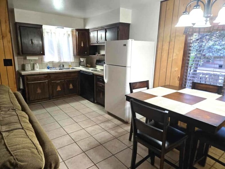 Cabin 1 Kitchen & Dining Area - 165 E White Mountain Blvd
