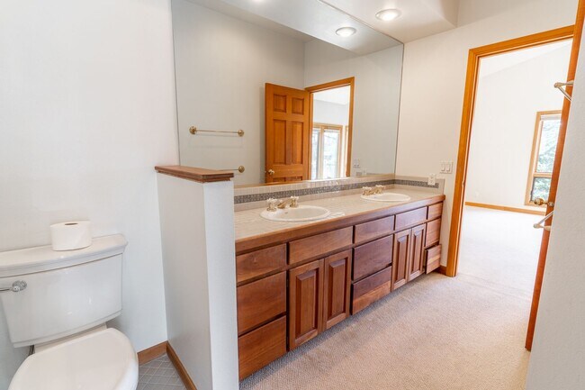 Building Photo - Private river access and stunning views from this home on Harmon Blvd! + Bonus Room