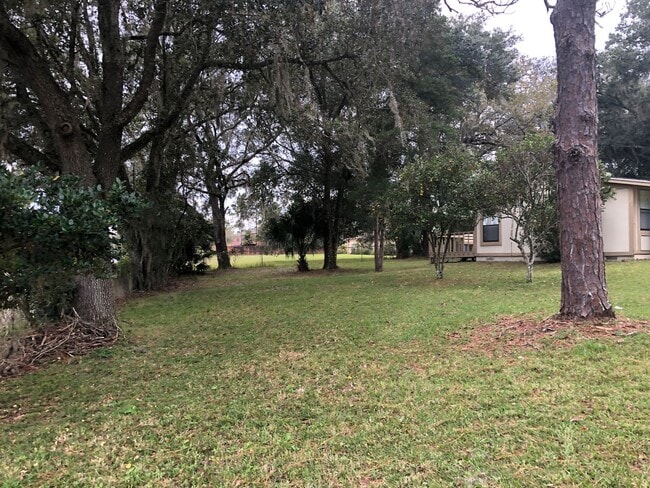 Building Photo - MOVE IN AUGUST!! COZY 2 BEDROOMS 1 BATHROOM HOME ON SPACIOUS FENCED IN LOT!! NEWER A/C!!