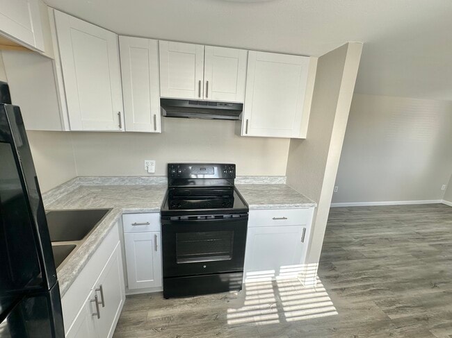 Experience culinary luxury in this stylishly designed kitchen. - Allison West Apartments