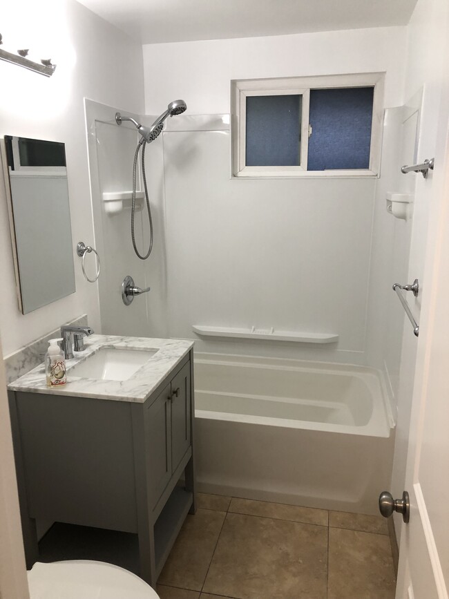 newer vanity with carrara marble top - 1214 N Park Western Dr