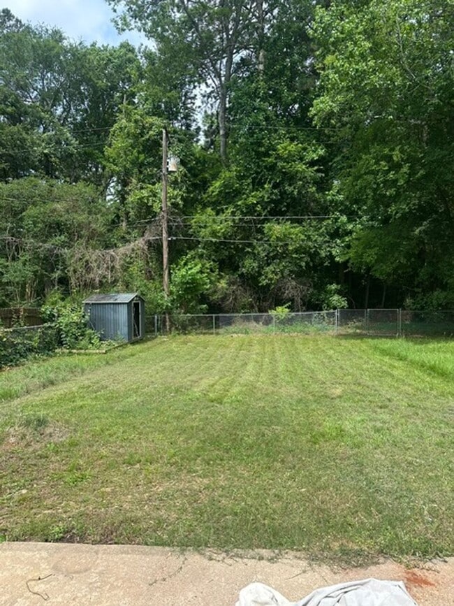 Building Photo - 4/1.5 PTISD Fenced yard and pet friendly
