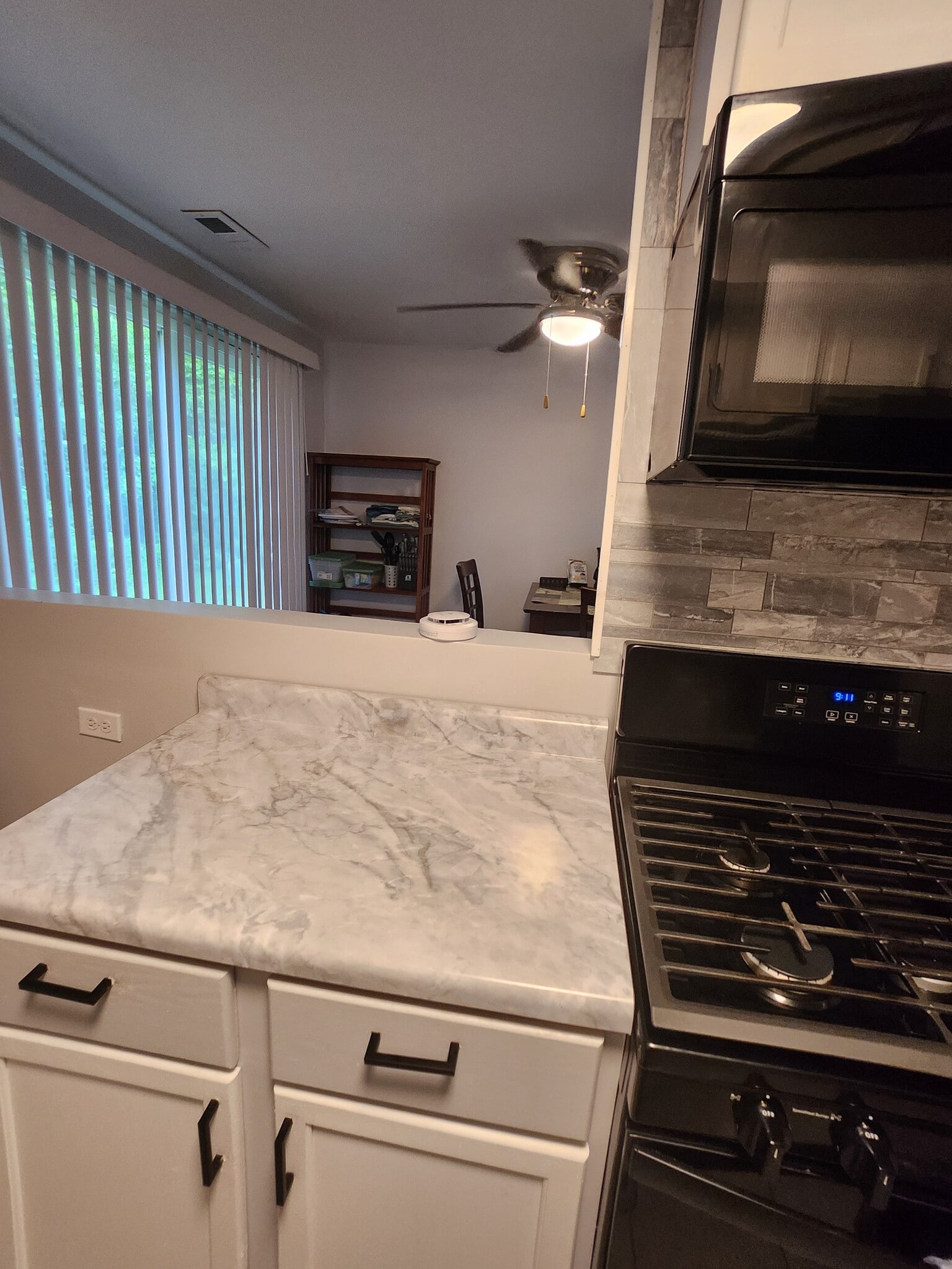 Galley kitchen facing back sliding doors and eating area - 946 Morningside Ln