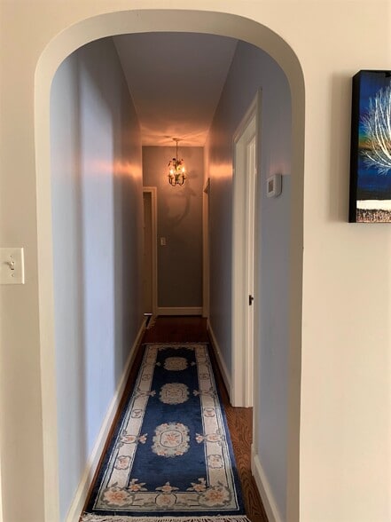 upstairs hallway - note arched doorframe - 5553 Little Falls Rd