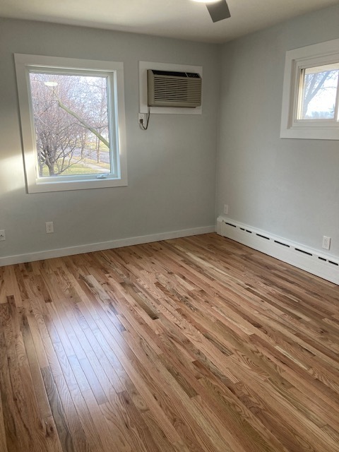 Large master bedroom with windows on two walls. Love that light! - 1430 4th St N