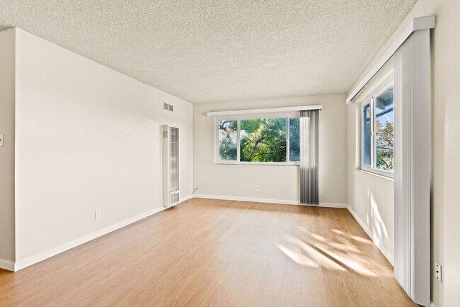 Building Photo - Utilities Included! Hayward 2-Bedroom with On-Site Laundry, Parking & Brand New Floors