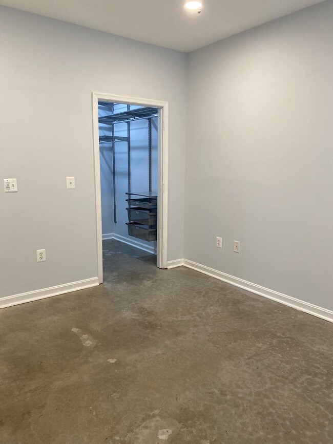 bedroom with walk in closet - 4860 Eisenhower Ave