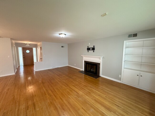Fireplace and storage space in living room - 5819 Blueridge St