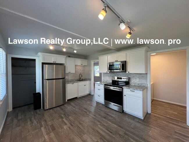 Building Photo - Updated, Cozy, and Clean- One Level Living...