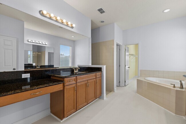 Building Photo - Spacious 6-Bedroom Home Near Lake Nona | 3-Car Garage + Tesla Charger