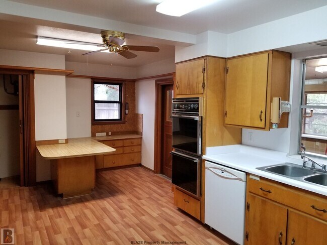 Building Photo - Massive Corner-Lot Home with Retro Charm & Shady Backyard!