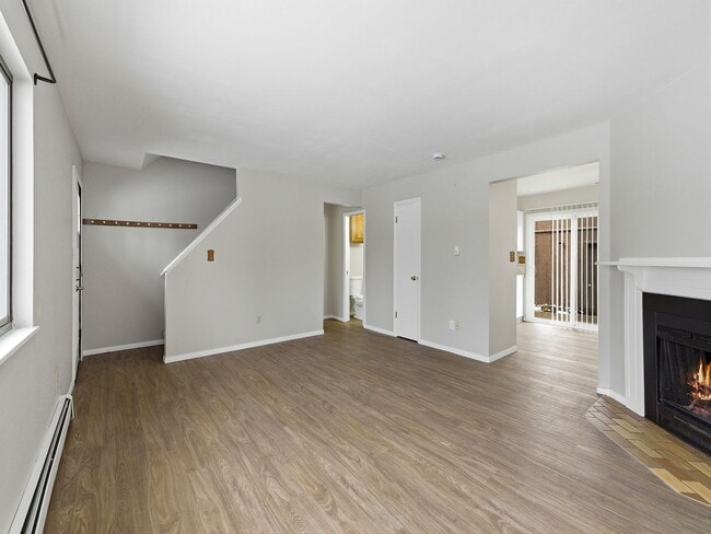 Building Photo - Spacious 2 Bed Condo W/ Bonus Basement Room, Fireplace & Garage Available NOW!