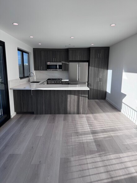 Living looking into kitchen - 2408 Highland Ave