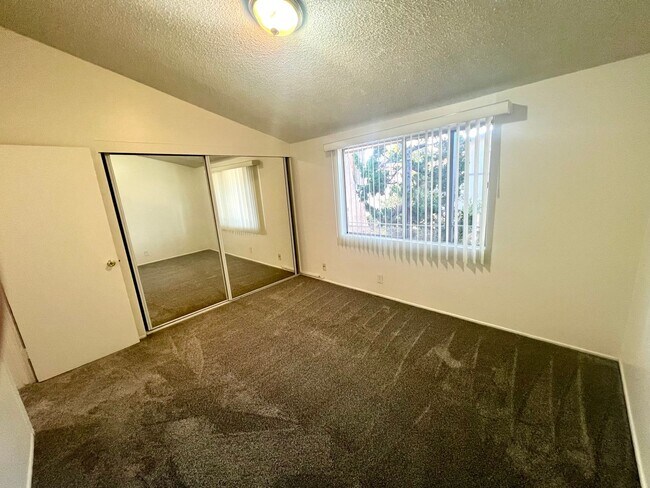 Building Photo - Spacious Two Bedroom with New Carpet - Available Now!