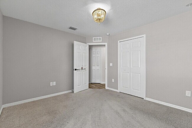 Building Photo - Modern 4-Bedroom, 3-Bath Home with Private In-Law Suite – Palm Coast, FL