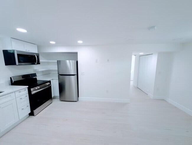 Building Photo - Fully Renovated, Sunny Basement Apartment