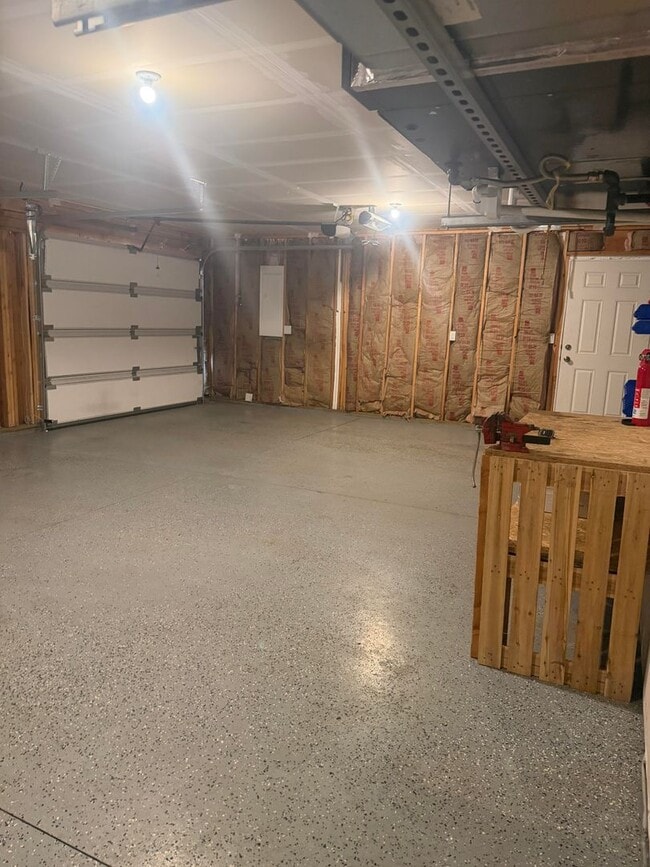 Building Photo - Lots of storage space in this 4- Car garage for all your playthings!!