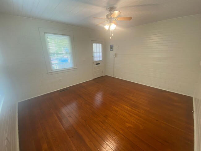 Building Photo - Walltown duplex with gleaming floors, a front porch, and a large pantry — all under $1,300.