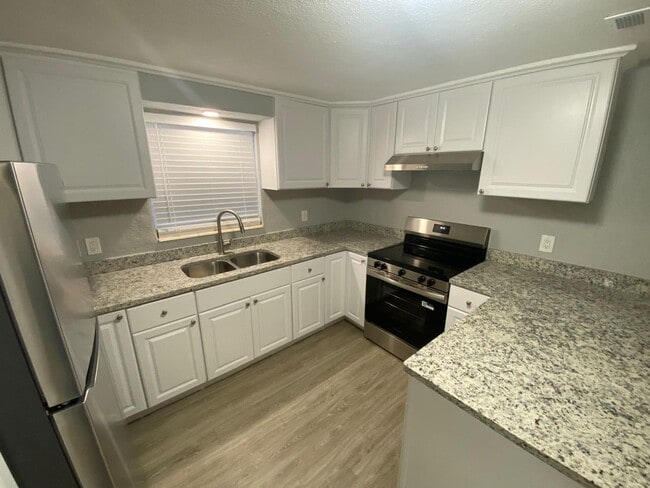 Building Photo - Fully Renovated 3-Bedroom Concrete Block H...