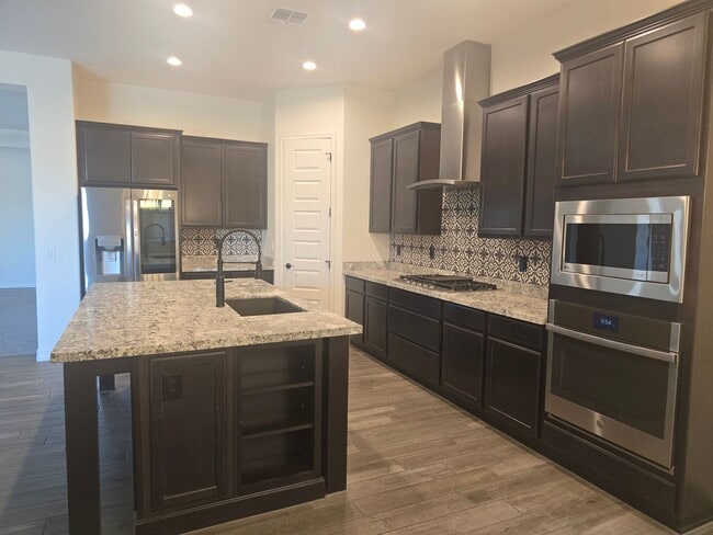 Building Photo - Five-bedroom CASITA home with a three-car ...