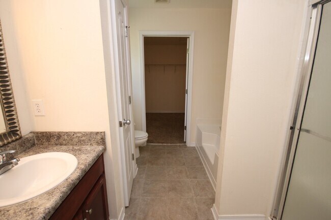 Building Photo - Spacious 4BR Home in Robin's Ridge with Soaring Ceilings, Guest Suite & Two-Car Garage
