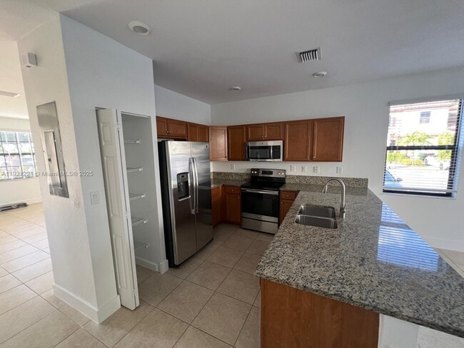 Building Photo - 9399 W 33rd Ln