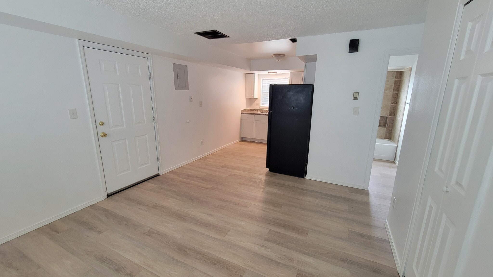 Kitchen from LIving room new LVP flooring - 6640 Provincial Dr