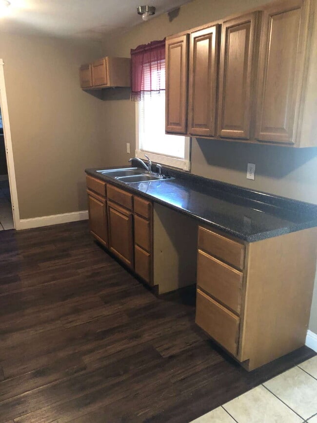 Building Photo - "Charming 4-Bedroom Home in Jonesboro with Cozy Fireplace & Gleaming Hardwood Floors!"