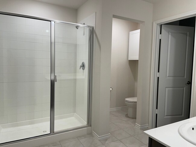 master bathroom with large walk in closet - 507 Farmhouse Ln