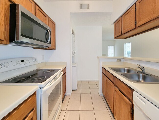 Building Photo - Beautiful two-story corner unit filled with natural light!
