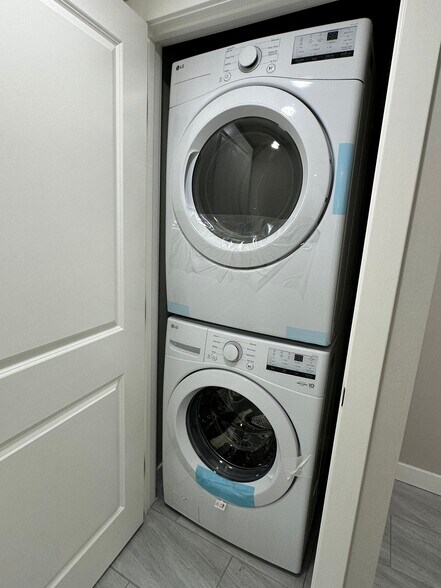 Inside modern front-loading washer and dryer - 1331 W Speedway Blvd