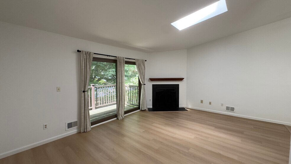 Living room with fireplace and balcony - 1714 Spruce Hills Dr