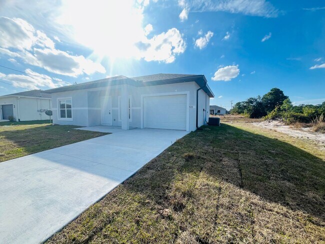 Building Photo - Brand-New Modern 2BR/2BA Home with Garage on Oversized Lot – Prime SW Lehigh Acres Location