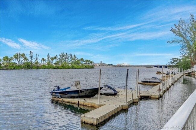 Building Photo - Rare 2/2 Corner Penthouse with Panoramic Lagoon Views from Every Room – Available Now!