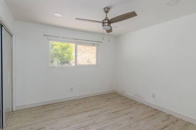 Building Photo - 5-Bedroom, 3-Bathroom Home with Solar Pane...