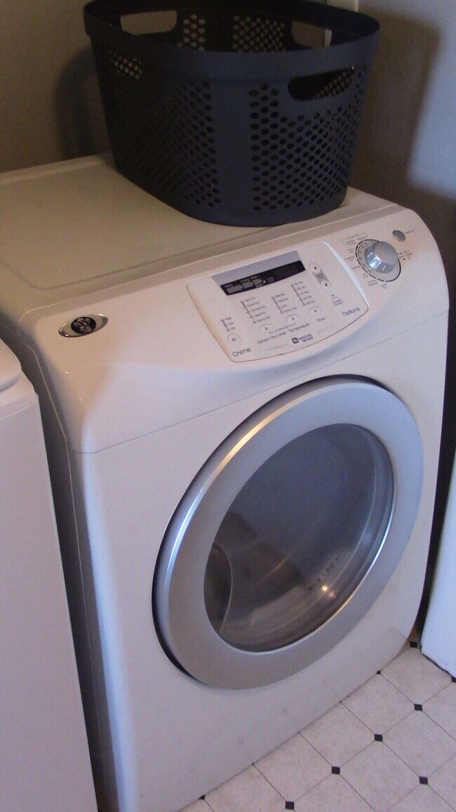 Laundry room with new sanitizing washer - 2710 Oliver Ave
