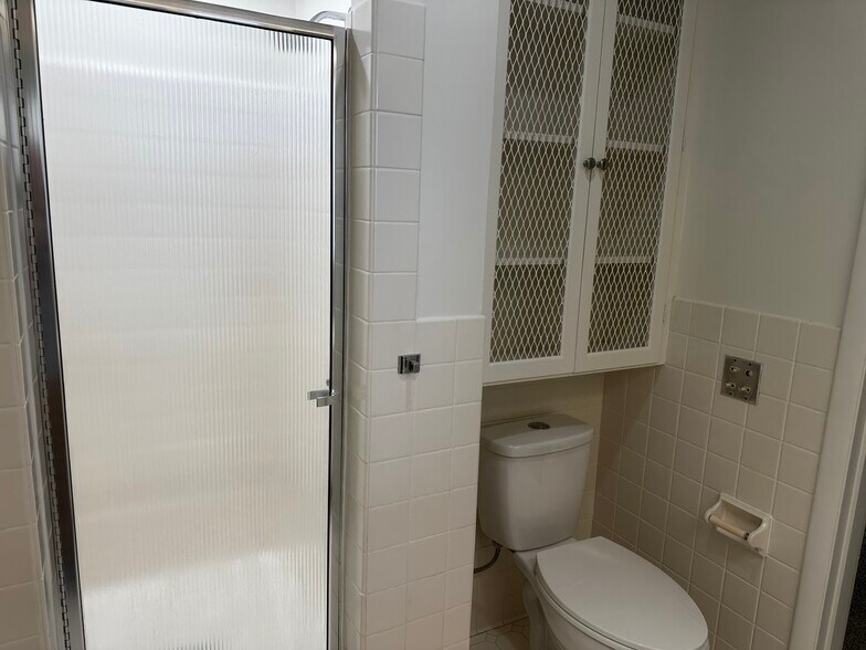Towel cabinet and dual flush toilet - 3030 Hardale Blvd
