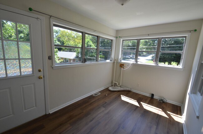 Building Photo - Charming 2-Bedroom, 2-Bath Single-Family Home with Sunroom & Wooded Views