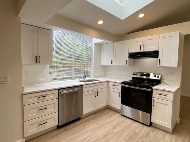 Building Photo - Stylishly Renovated Home with Private Back...