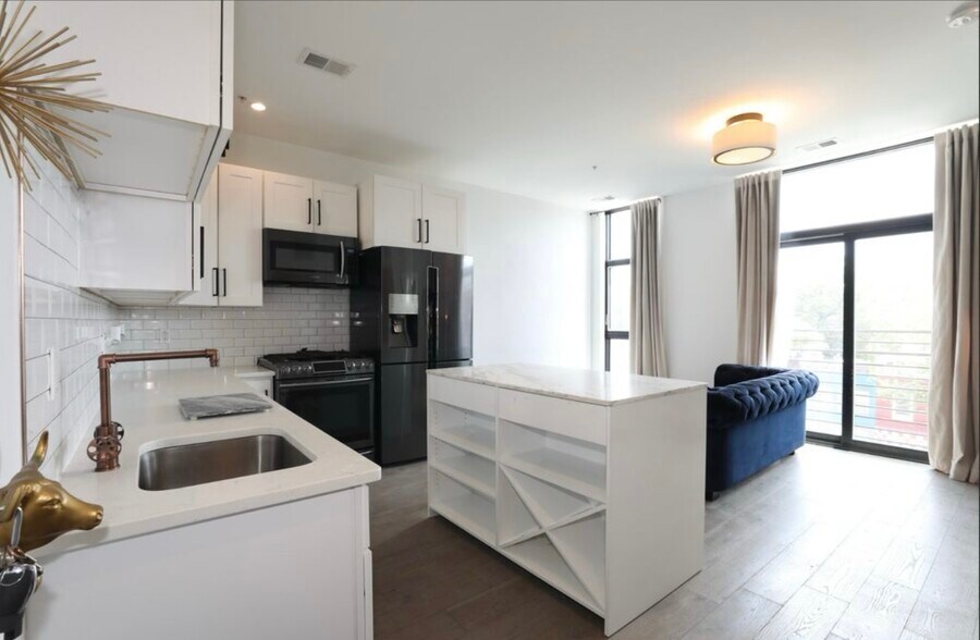 Main living room and kitchen area - 1402 H St NE