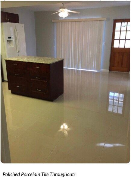 Polished porcelain tile throughout main living space - 3633 Country Club Blvd