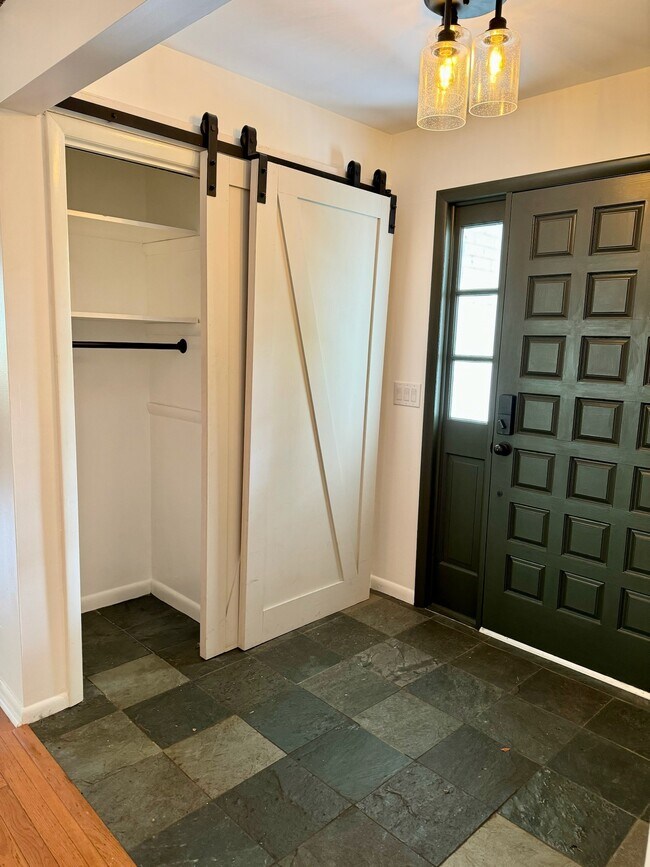 Entry way from the front door with double storage closetes - 6111 Northlakes Dr