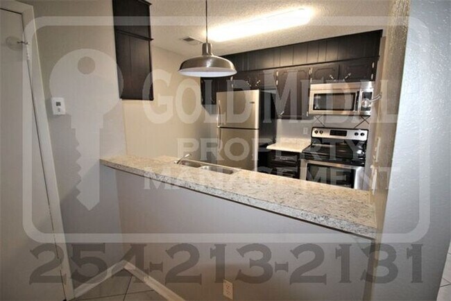 Building Photo - A charming 2-bedroom, 1.5-bathroom townhome now available for rent!