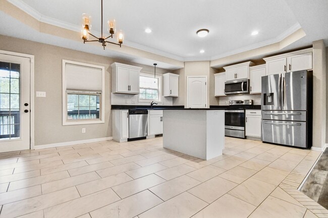 Building Photo - Pet Friendly Three Bedroom with Bonus!